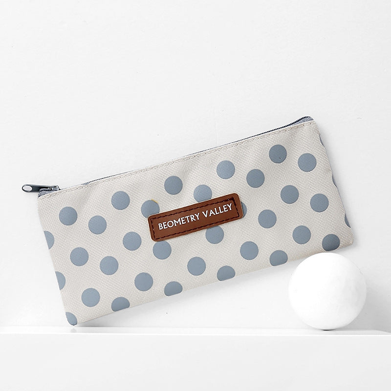 trousses minimalistes en tissu blanche avec pois bleu